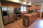 This spacious kitchen is equipped with modern and energy efficient stainless steel appliances